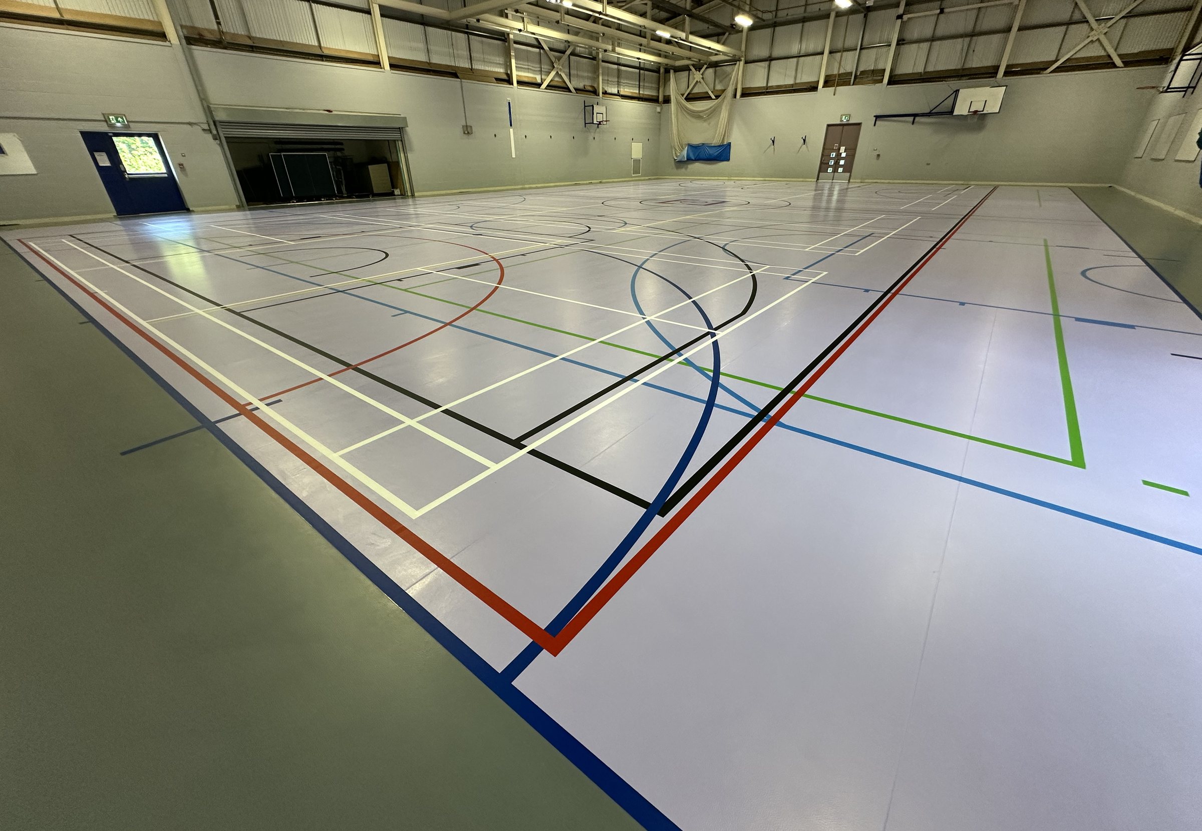 South Devon College sports hall with its new two-colour floor and completed court markings
